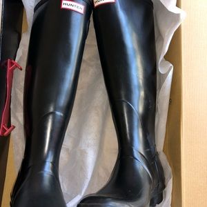 Tall black hunter boots